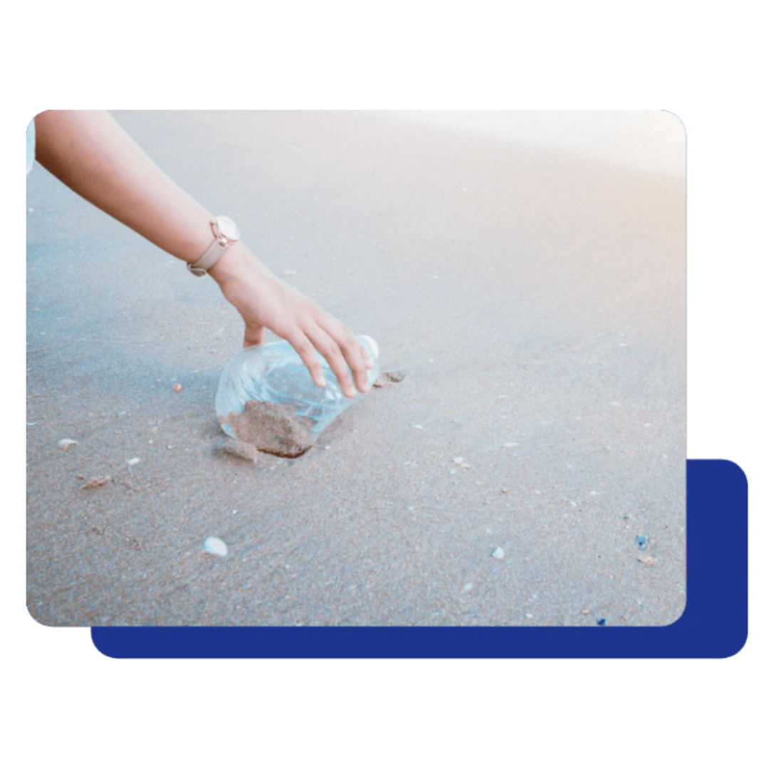 A Healthy Future Picking up a plastic bottle from the beach.