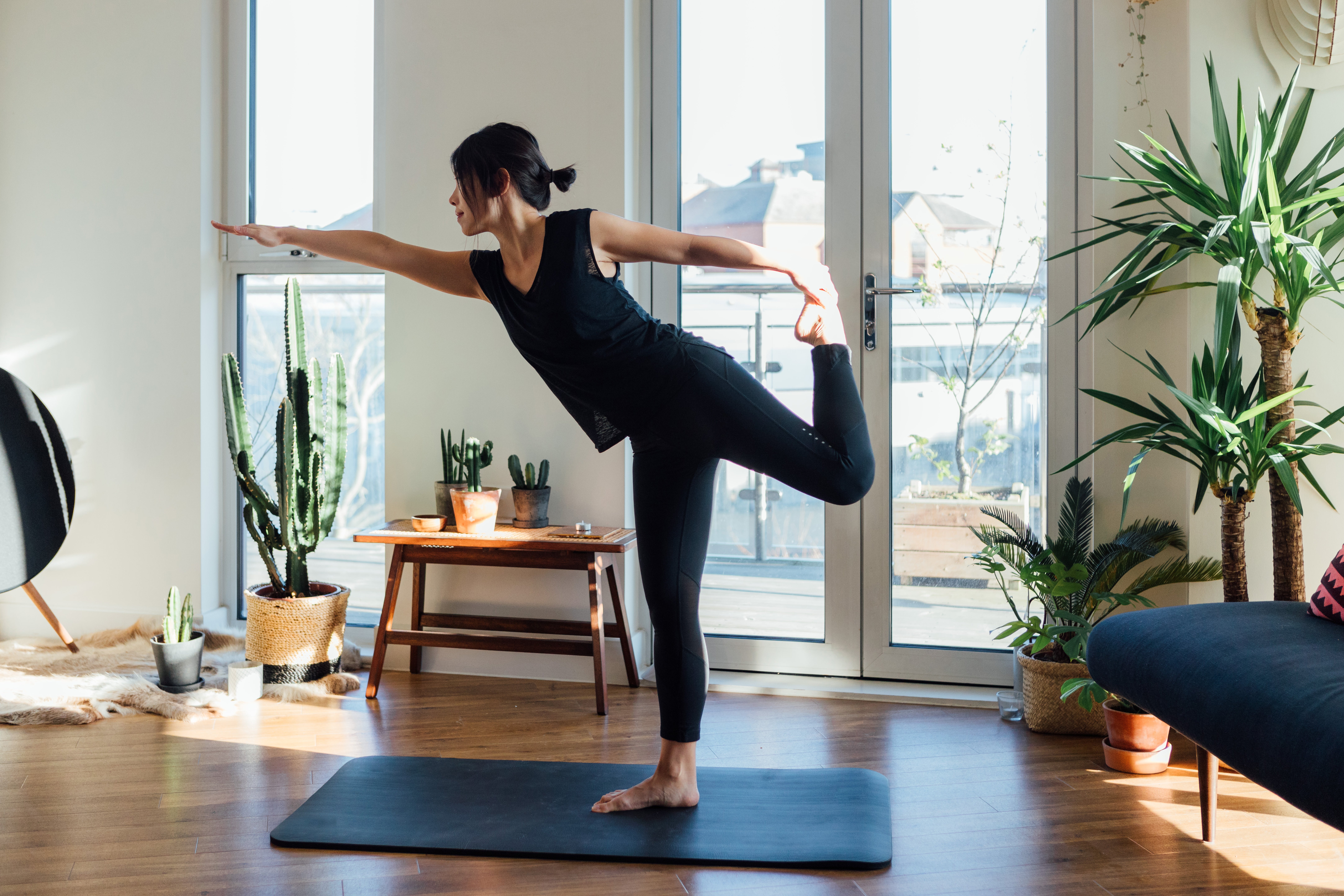a-women-doing-yoga-in-her-living-room