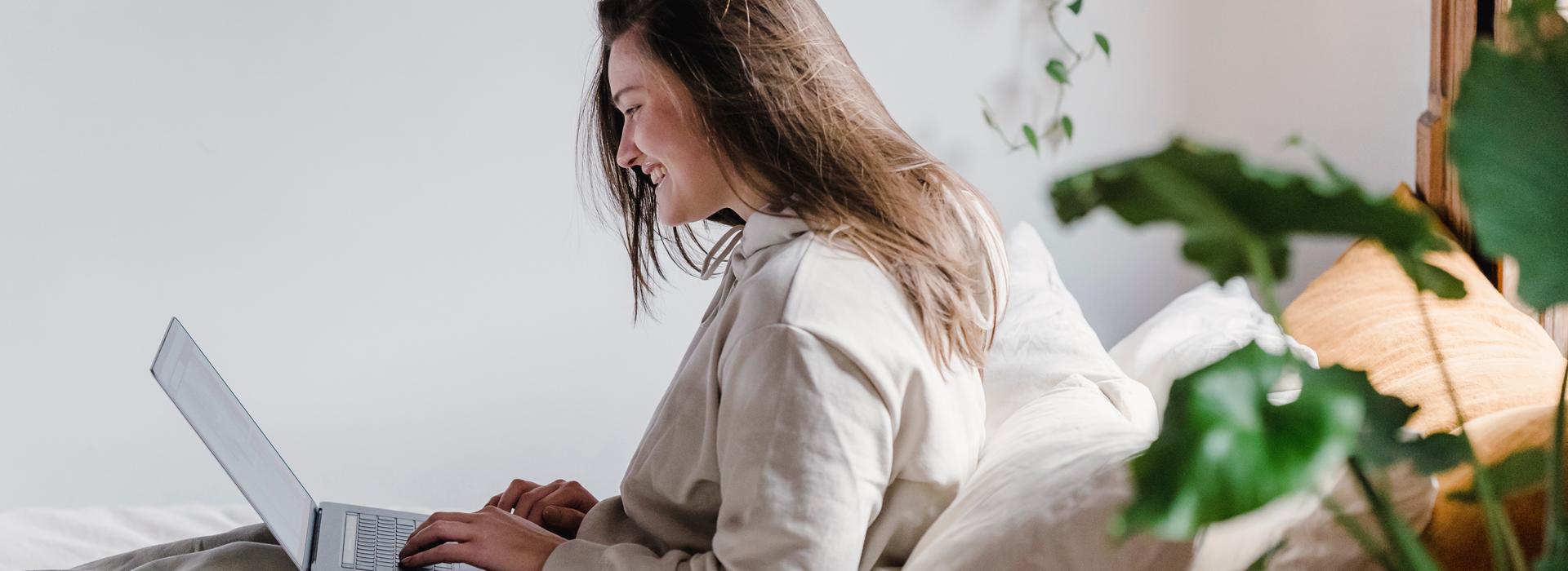 women-working-on-computer-and-smiling