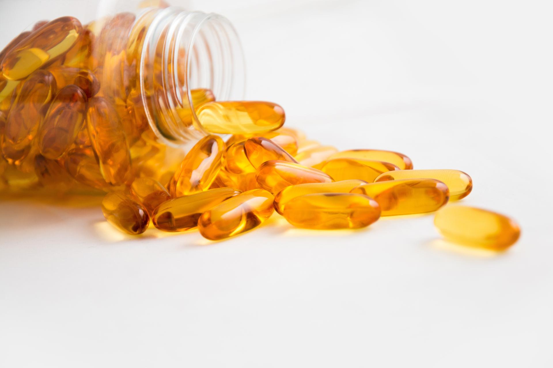 vitamins-coming-out-of-a-supplement-bottle