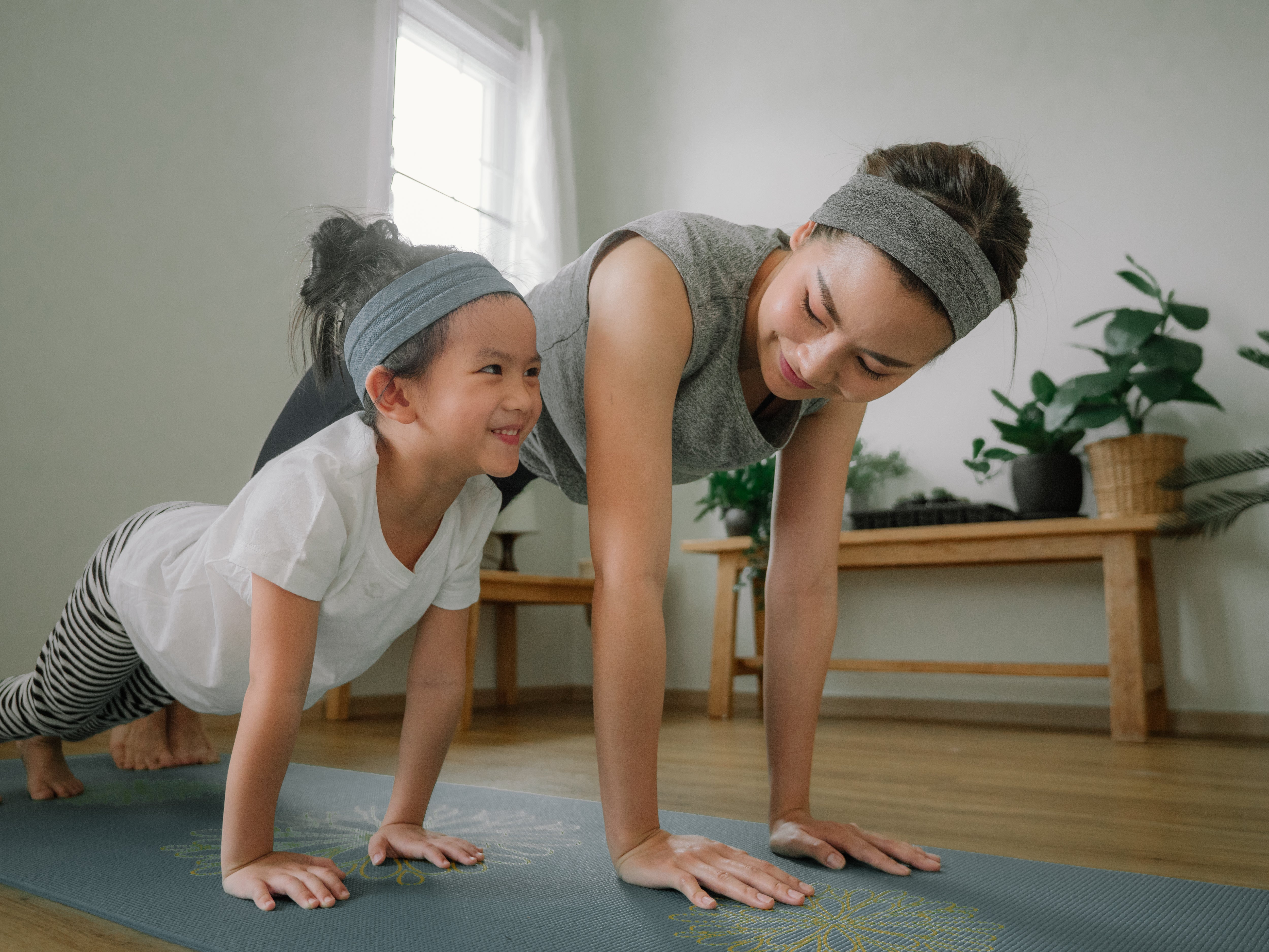 Mother and daughter doing yoga