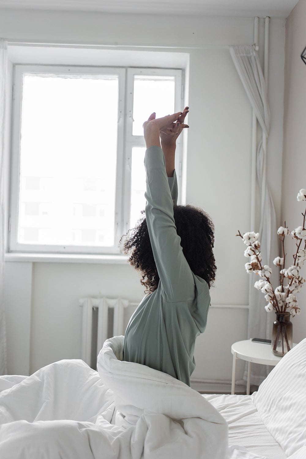Women stretching in bed 