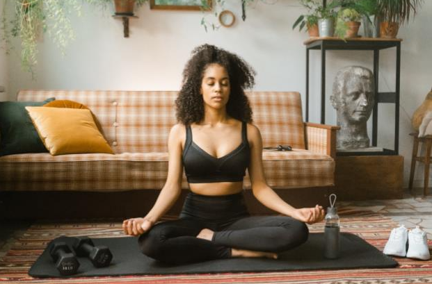 Women doing yoga in her living room