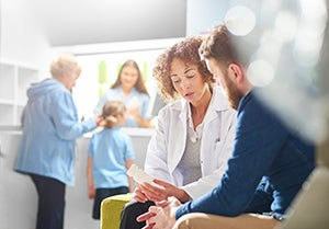 Women doctor talking to her patient