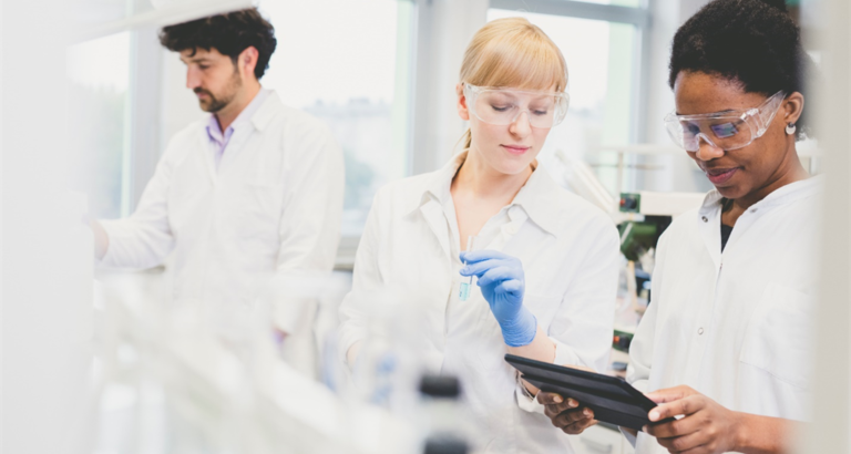 Two women and a man working in a laboratory
