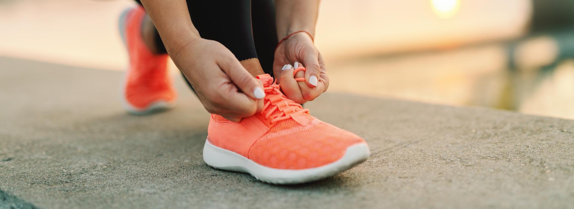 Women tying her running shoes