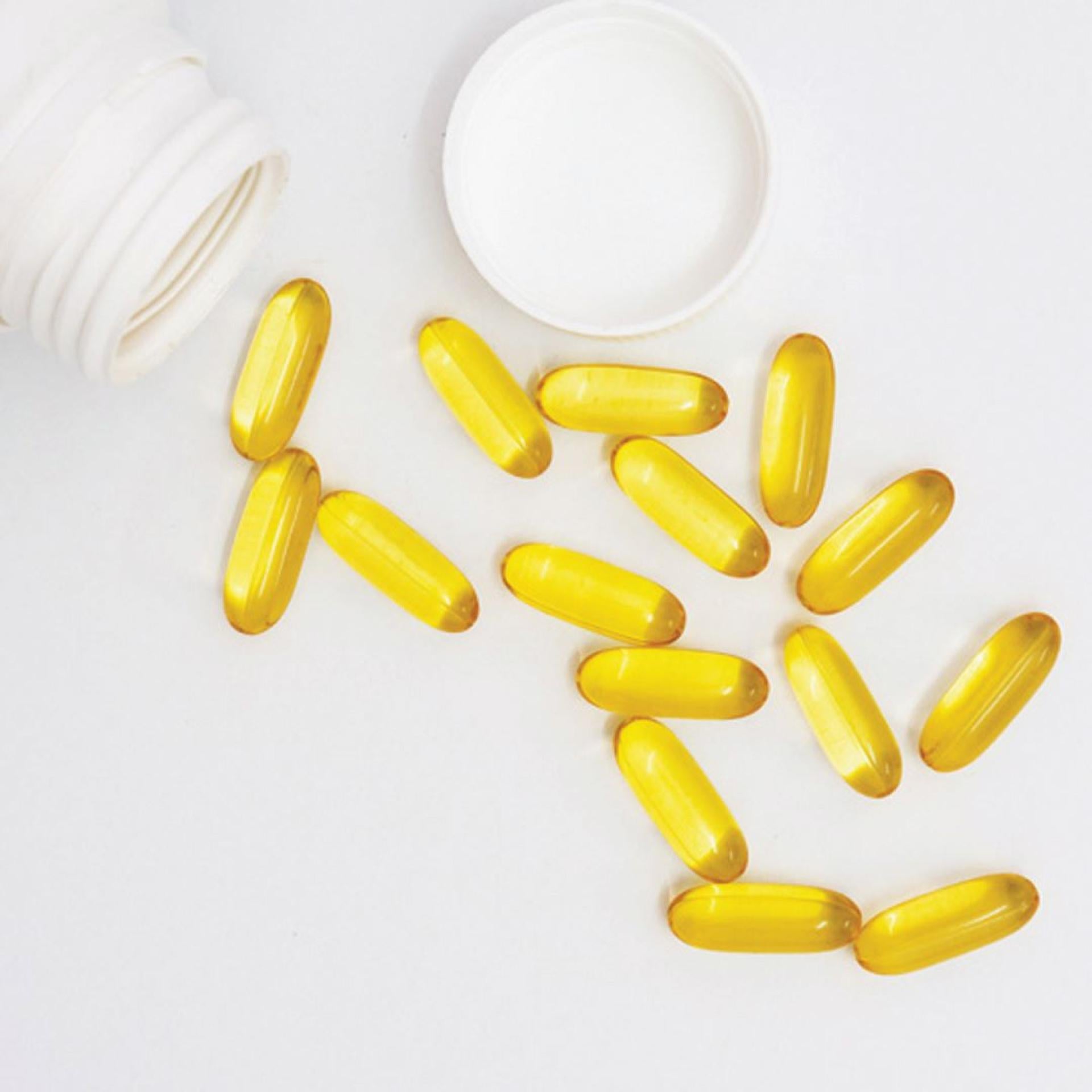 Suppléments Pure Encapsulations à côté d’une bouteille